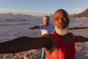 Senior,African,American,Couple,Performing,Stretching,Exercise,Together,At,The